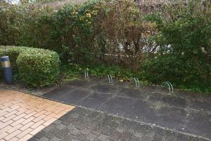 a parking lot with a bunch of bars in it at Sonnenseite Ferienwohnung in Niendorf
