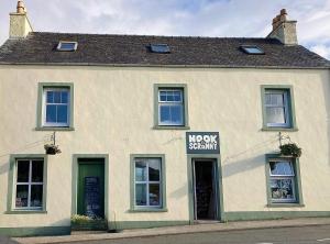 a building with a moveshawham sign on the front of it at Nook and Scranny in Tarbert