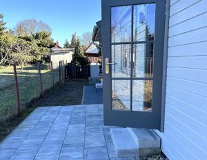 a door to a house with a patio at Ferienhaus HarzHase in Harzgerode