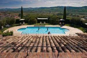 a view of a swimming pool from the roof of a house at Borgo Storico Seghetti Panichi in Castel di Lama