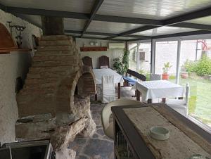 a living room with a stone oven in a room at Villa Savovi in Varna City +11 photos