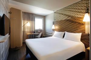 Кровать или кровати в номере Hotel ibis Lisboa Liberdade