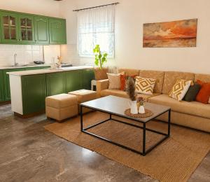a living room with a couch and a table at Acheron House in Gliki
