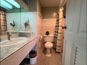 a bathroom with a toilet and a sink at Cozy 1br walk to BTS and Airport Rail Link Close to Malls G7 in Bangkok +75 photos