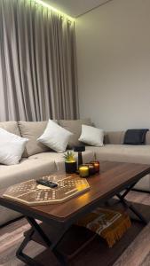 a living room with a couch and a coffee table at استديو in Al Khobar