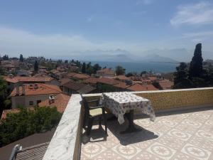 a table and chair sitting on top of a balcony at Sunrise Hotel in Antalya