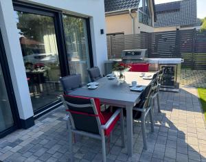 a table and chairs sitting on a patio at Strandhaus Marie-Team in Göhren-Lebbin