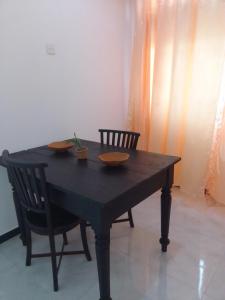 a wooden table with two bowls on top of it at Villa Aloe Vera- Signature Rooms in Weligama +24 photos