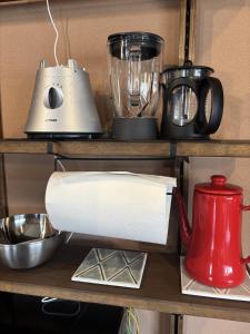 a roll of paper towels and a blender on a shelf at Dar Sahha in Nara
