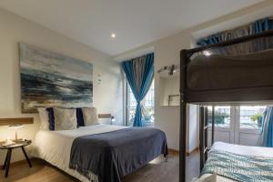 a bedroom with a double bed and a window at Family House in Aveiro