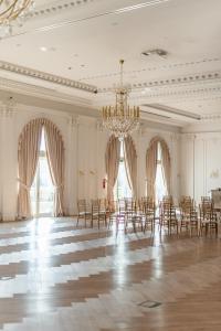 a large room with chairs and a chandelier at Hotel Kiston in Sulęczyno +44 photos