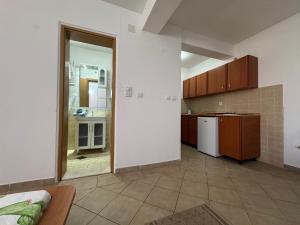 a room with a kitchen and a living room at SS Pearl Apartment 1 in Utjeha