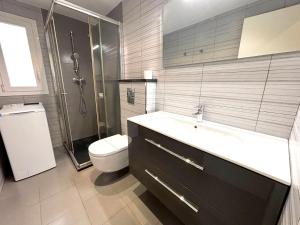 a bathroom with a sink and a toilet and a shower at Rhode 1b in Roses