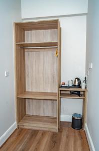 a wooden book shelf in a room at Iveagh Lodge in Dublin
