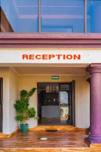 a red sign on the front of a hotel at 606 Guesthouse in Bushbuckridge