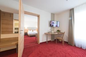 TV a/nebo společenská místnost v ubytování Hotel Restaurant Bären