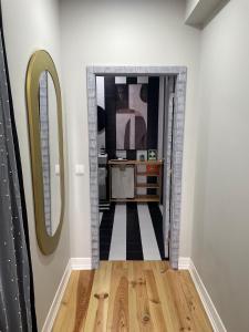 a hallway with a mirror and a dressing room at Salina Ria Studio 2 in Aveiro