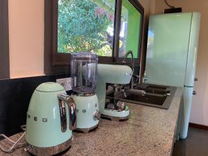 a blender sitting on a counter next to a window at Villas Kokoa Serena in Sainte Marie