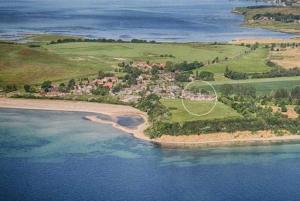 an aerial view of a small island in the water at Fewo 18 im Strandhaus Lobbe mit Balkon in Lobbe