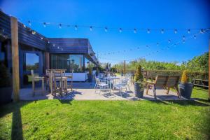 a patio with a table and chairs and a table and chairs at Forest Hills Hotel & Country Club in Frodsham +52 photos