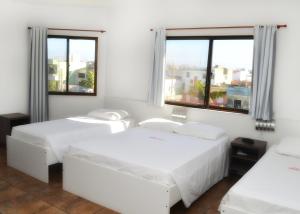 Ένα ή περισσότερα κρεβάτια σε δωμάτιο στο Arpini Hotel
