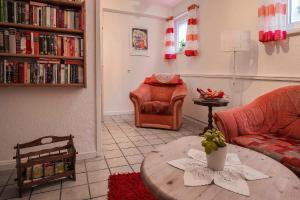 a living room with a couch and a coffee table at Pension Haus Brückner in Wildemann