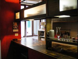 a kitchen with a wooden counter top in a room at Pitti House in Florence