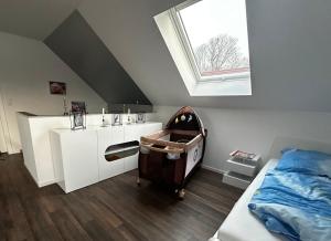 a room with a bed and a toy in a room at Ferienhaus Kronseeliebe in Lychen