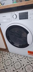 a white washing machine sitting on top of a counter at Stratford Terrace in Beeston