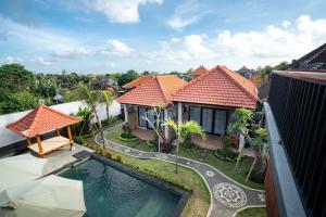 an aerial view of a house with a swimming pool at Ulu Apsura Villas in Uluwatu