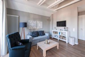 a living room with a couch and a table at "Villa Minerva" Ferienwohnung 09 in Kühlungsborn