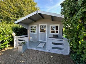 a small shed with a bench in it at "Ferienhaus Großenaspe" in Großenaspe