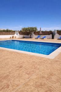 a swimming pool in the middle of a yard at Casa Castillo in Huércal-Overa