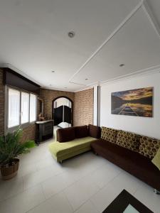 a living room with a couch and a table at El paraíso I in Raxó