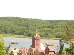 a building in the middle of a river with boats at Rügen Fewo 211 in Parchtitz