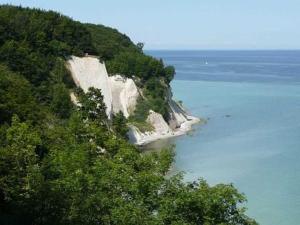 a large white cliff sticking out of the water at Rügen Fewo 211 in Parchtitz