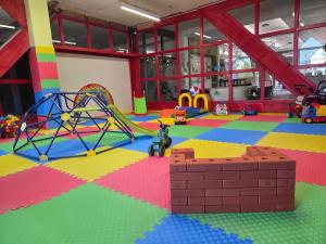a large room with many different types of playground equipment at Hotel Skicentrum in Harrachov