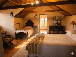 a bedroom with two beds in a room at Route 62 B&B in Robertson