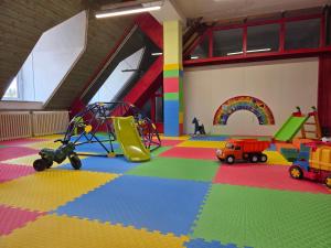 a large room with many different types of play equipment at Hotel Skicentrum in Harrachov +65 photos