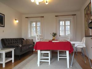 a living room with a table and a couch at Ferienhaus Baumgarten1 in Gnas