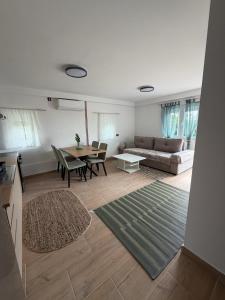 a living room with a couch and a table at Apartman Antonio 2 in Karlovac