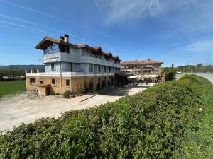 a building on the side of a road at RoomRural Hotel Iru-Bide Lumbier in Lumbier
