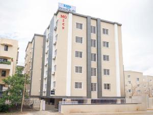a large building with a sign on top of it at Z Express Zen Elite in Pune