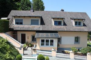 a house with a gray roof at Appartement Ferienwohnung Bilek in Gmunden +42 photos