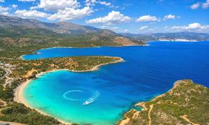 an aerial view of a beach with a boat in the water at Istron Homes in Istro