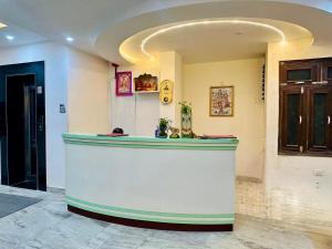 a bar in a room with a counter in a room at Hotel Umang in Sītāmarhi