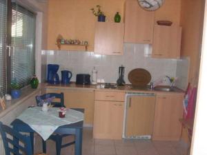 a kitchen with a table and a table and a table and a table at Ferienwohnung Ziebell in Bollewick