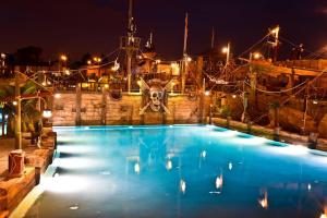 a large swimming pool with a picture of a ship at Hôtel Cap Pirate in Cap d'Agde