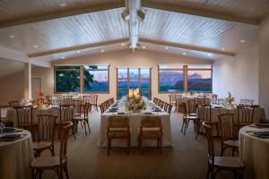 a banquet hall with tables and chairs in a room at Red Cliffs Lodge Moab in Castle Valley