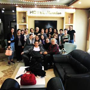 a group of people posing for a picture in a room at Karakoçan Hotel Hanedan in Karakoçan